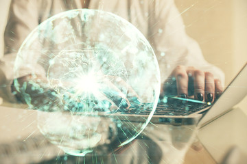 Double exposure of woman hands typing on computer and business theme hologram drawing. Success concept.