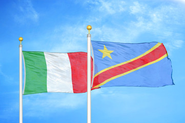 Italy and Congo Democratic Republic two flags on flagpoles and blue cloudy sky