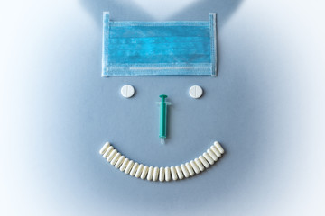 Syringes and tablets on a blue background. Medical concept