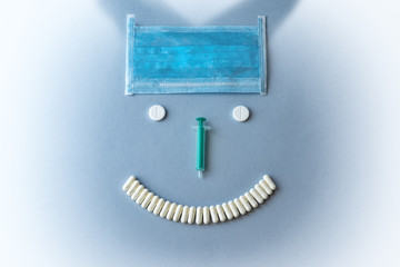 Syringes and tablets on a blue background. Medical concept