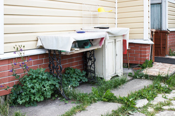 Home-made place in the courtyard of a country house for washing dishes and cooking