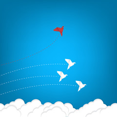 hink differently concept. Be different. Red bird changing direction. New idea, change, trend, courage, creative solution, innovation and unique way concept	