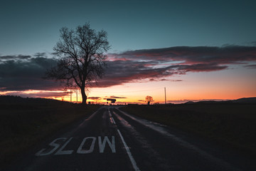 Dramatic Clouds over Empty Countryside Road