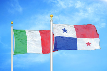 Italy and Panama two flags on flagpoles and blue cloudy sky