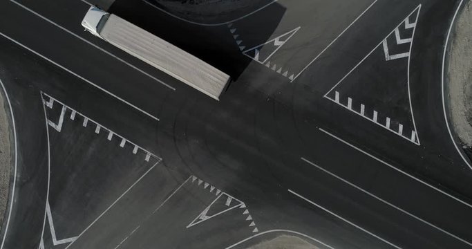 Trucks cross the intersection top view