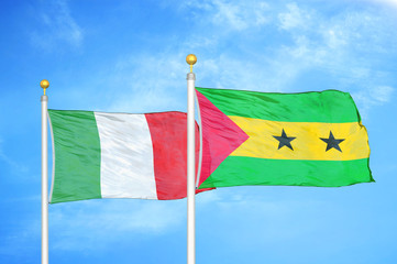 Italy and Sao Tome and Principe two flags on flagpoles and blue cloudy sky