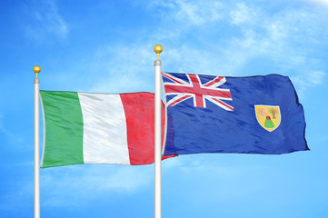 Fototapeta premium Italy and Turks and Caicos Islands two flags on flagpoles and blue cloudy sky