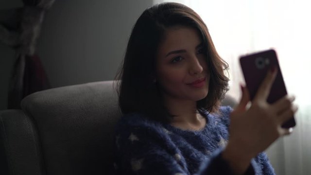 Young Woman Is Taking Selfie From Home During Quarantine Time At Coronavirus.