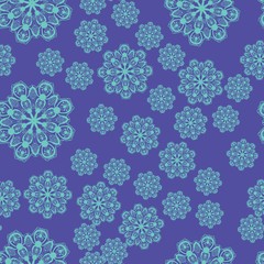 Many blue snowflakes form an endless pattern on a purple background