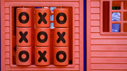 Obraz premium Red Plastic Tic-Tac-Toe Children Playground Kids Game