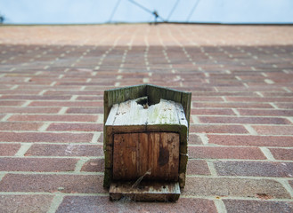 Bird box attached to brick wall of a suburban house,Andover,Hampshire,United Kingdom.
