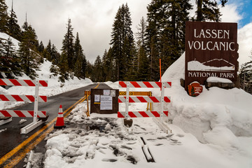 PLUMAS COUNTY, CALIFORNIA - MARCH 31,2020 - Signs and barricades notify would-be visitors of the closure of Lassen Volcanic National Park and prevent entry due to the COVID-19 novel coronavirus.