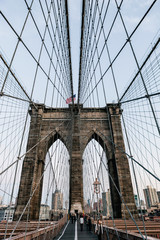 Vertical view of one of the Brooklyn Bridge pillars from the pedestrian path. Manhattan