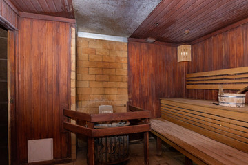 Fototapeta na wymiar Sauna and sauna accessories on an interior background