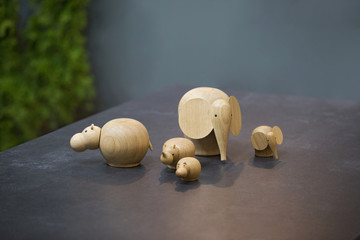 Small wooden toys in the form of animals, an elephant, a hippo, rhino