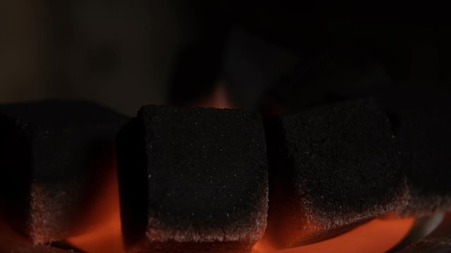 Hookah hot coals for smoking natural lighting close up. Time Laps