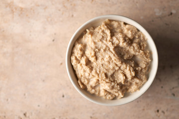 Overhead View of Cooked Oatmeal in Bowl with Copy Space