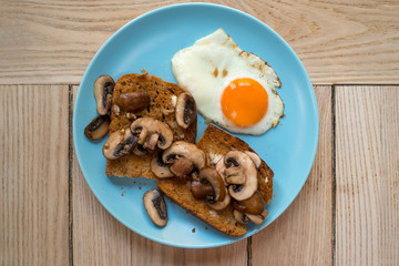 Mushrooms on Toasts and an Egg on Plate