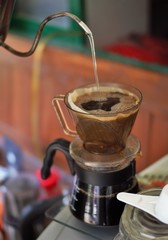 coffee maker pouring coffee into cup