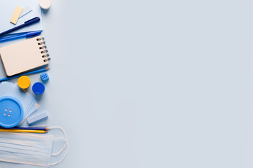 School Quarantine global pandemic corona virus covid-19 to school, tools, notebook medicine mask pencil on blue background, stylish banner flyer, preventive measure