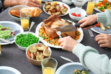 Family celebrating Thanksgiving Day at home