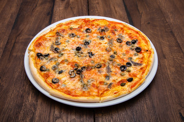 Classic Italian pizza on a wooden table