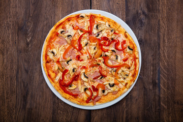 Classic Italian pizza on a wooden table