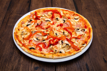 Classic Italian pizza on a wooden table