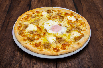 Classic Italian pizza on a wooden table