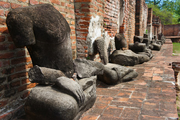 Fototapeta na wymiar Buddha Lotus Position Meditation Ruins in a Row