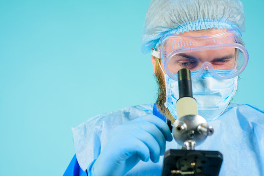 Microscope. Doctor with microscope. Work in laboratory. Microbiologist working with microscope in laboratory. Laboratory researcher concept. Scientific research. Medical equipment. Healthcare.