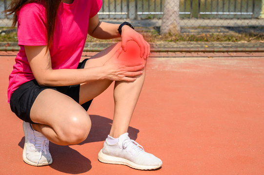 Cropped shot of woman runner suffering from knee pain. It often happens when your kneecap is out of alignment. Conceptual of common running injuries.