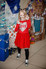 little girl with christmas tree 