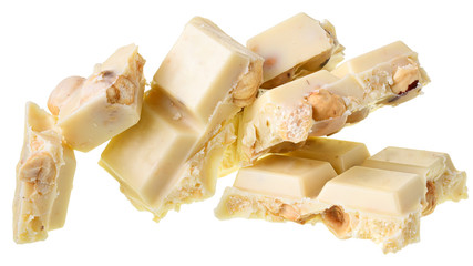 Broken white chocolate with whole hazelnut nuts Isolated