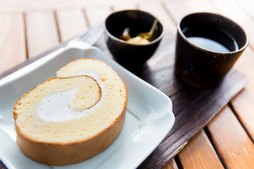 Roll cake with tea in the morning