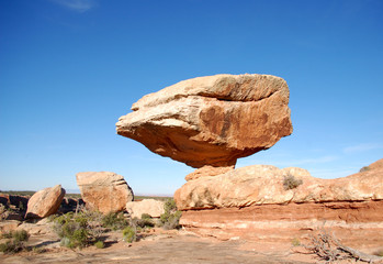 Massive balanced boulder in canyon country in the Bears Ears wilderness of Southern Utah.