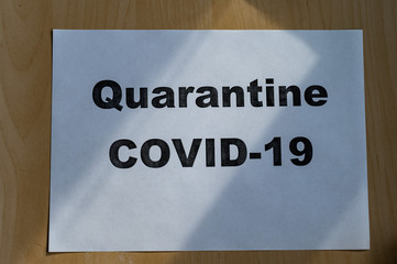 The inscription on a piece of paper Quarantine. Pandemic covid-19. Stay at home. The epidemic of Wuhan.