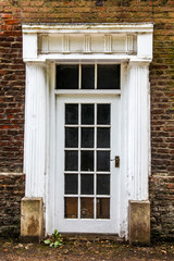 Fototapeta na wymiar old wooden door in a stone wall