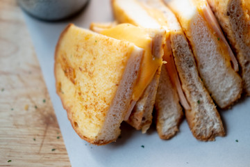 Triangle toast bread with ham and cheese.