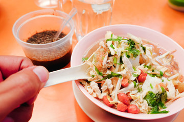 Bone marrow soup also known as soup gear box.served in a pink bowl.