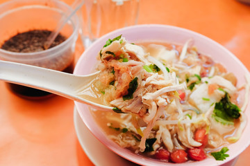 Bone marrow soup also known as soup gear box.served in a pink bowl.