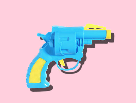 plastic toy gun for kid isolated on color background, Water gun for kid