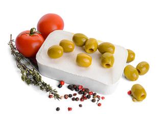 Tasty feta cheese, olives and spices on white background