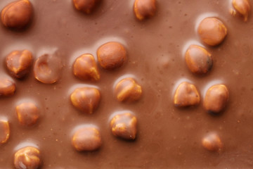 Sweet chocolate with nuts as background