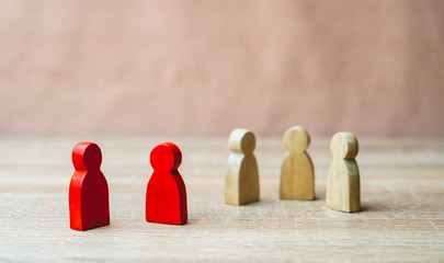 Social distancing during the Corona virus outbreak, red wooden Figure were infected Exclude from people who are not infected to prevent increased outbreaks in Social distancing or infectious concept.