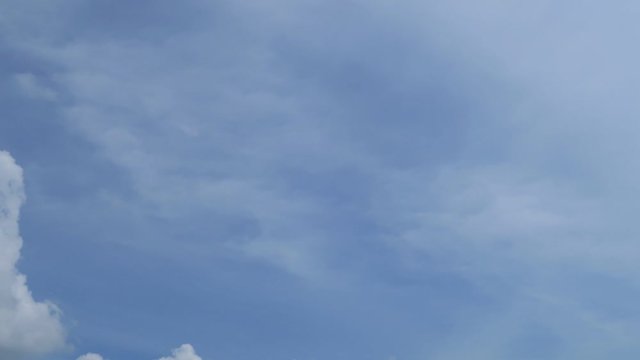 Beautiful white smoky fluffy cirrus & cumulus clouds on tropical summer or spring bright blue sky background in sunny day TimpLapse for transitional & meditative motion vdo or nature related project