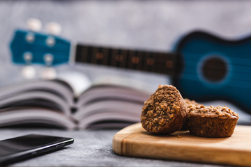 stay home to flatten the curve, desk with mixed leisure activity to do indoor at home including baking reading music or spending time online