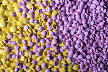 colored medicines background closeup. Drugs, painkillers, colds and other pills.