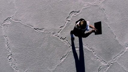 Top view of millennial hipster girl with digital tablet touching to virtual reality and stereoscopic immersion in visual simulation, young woman working at publicity area using modern headset
 - Powered by Adobe