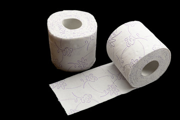 Toilet paper roll. Soft tissue isolated on black background. Cleaning concept product photograph for advertising